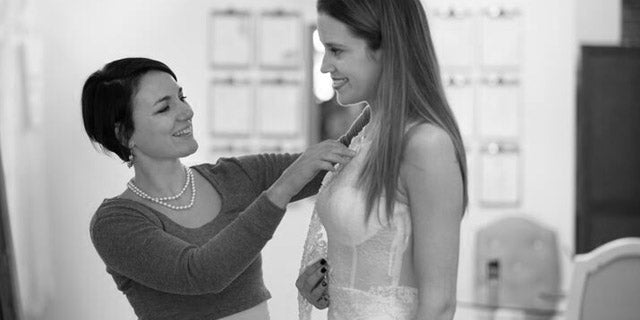 Designer measuring and designing with a bride | Vanya Designs Bridal Studio | Wichita, KS
